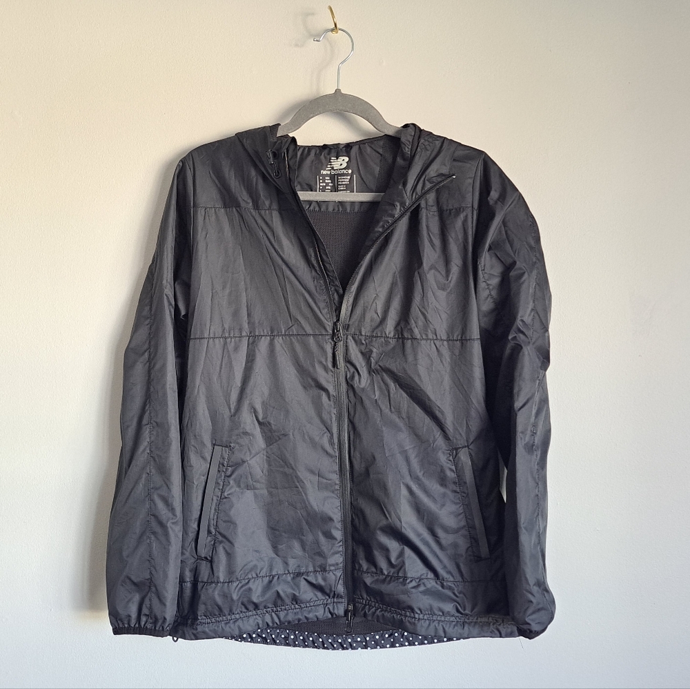 New Balance trackster woven wind-breaker with polka dot back